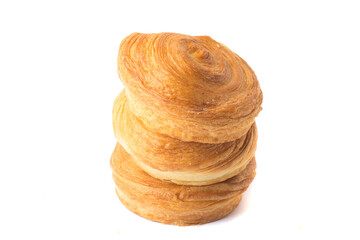 pyramid of three homemade baking. Sweet round bun roll swirl, isolated on a white background, close-up