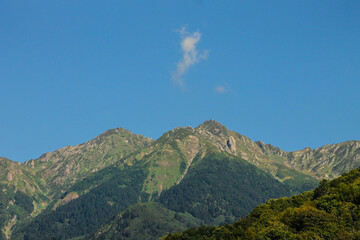 Fototapeta na wymiar Green mountain landscape, clear blue sky