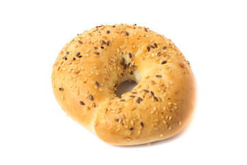 Traditional whole wheat bagel with linseeds and sesame seeds isolated on white