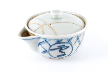 white and blue teapot , kintsugi the beauty of imperfection. Japanese artisan traditional...