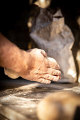 handcrafted bread-making sourdough hand flour sunlight ray of light knead sunshine detail  © simone