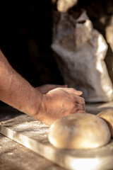 handcrafted bread-making sourdough hand flour sunlight ray of light knead  © simone
