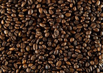 Fresh dark coffee beans close up