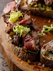 Fried bread with meat and lettuce leaves