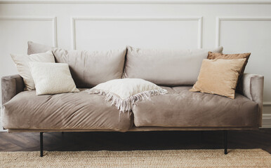 gray sofa with pillows
