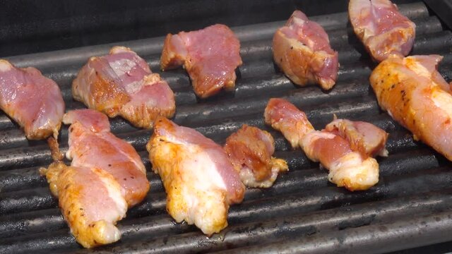 Cooking bacon on grill. Grilling bacon