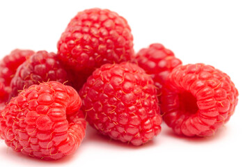 Closeup of red raspberry berries on white background