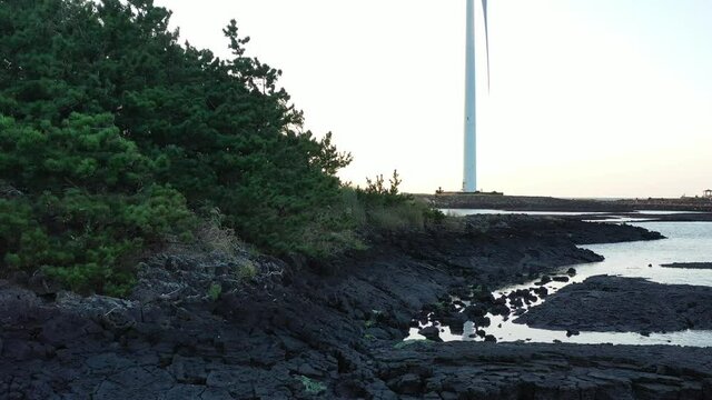 Drone video showing red sunset and windmill
