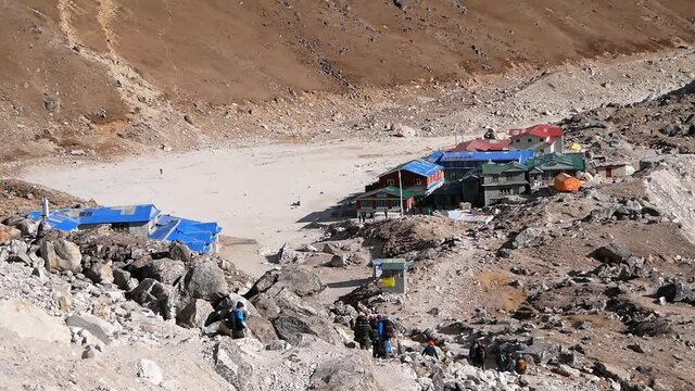 Group of trekkers arriving in small Sherpa village Gorak Shep (5,207m), Khumbu, Nepal in the Himalayas, the last stop on Everest Base Camp Trek.