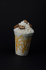 Coconut milkshake with caramel and sneakers.