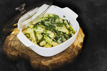 Traditional olive oil celery, healthy deliciouson the black ground. Turkish meal.