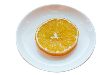 Plate with one slice of dried orange isolated on white background.