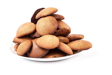 Brown homemade round shape cookies lined with a slide on a plate on a white isolated background in a photo studio. Sugar-free dietary oatmeal cookies with fructose.