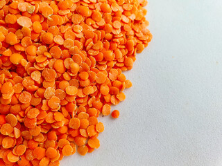 dried orange lentils. Red lentils on white background. Top view. Food background