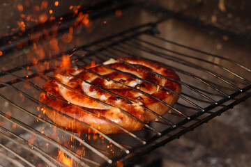 grilled sausage on fire