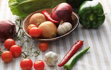 Onions, garlic, tomatoes and bell peppers.