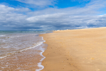 beautiful wide empty golden sand beach