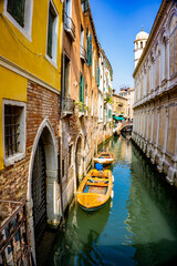 Boats at narrow canal in Venice, Italy