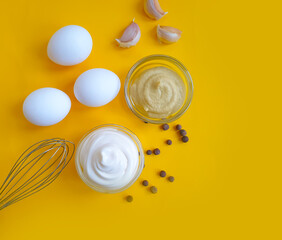 homemade mayonnaise, eggs on a colored background