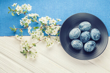 Easter marble eggs in a black plate
