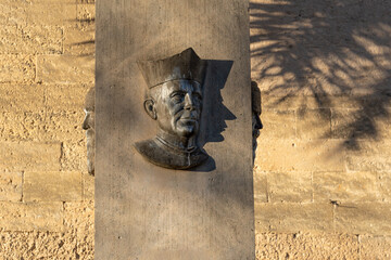 Sculpture of three bronze busts at the entrance of the church of Vilafranca de Bonany