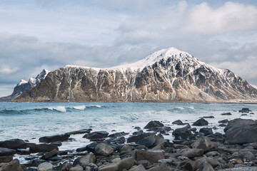 Fototapeta na wymiar Beautiful landscape. Lofoten Islands. Sea, stones, mountains and clouds.