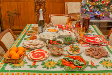 Delicious food and snacks on a festive served table on New Year's and Christmas Eve