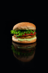 The perfect burger classic burger American burger with chicken, lettuce, tomato and sauce.