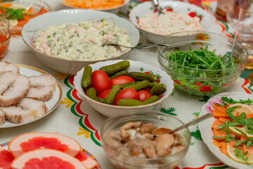 Delicious food and snacks on a festive served table on New Year's and Christmas Eve