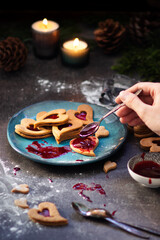 Czech traditional christmas sweets Linzer cookies with homemade red currant jam