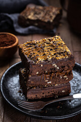 Dark Chocolate Brownies Stacked on a Plate