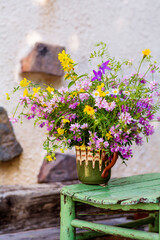 Beautiful Wild Spring Purple and Yellow Flowers  in a Small  Vintage Vase 