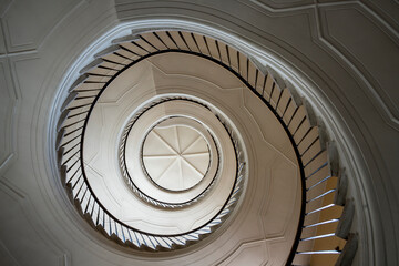 Beautiful winding staircase in an old tenement house © malajscy