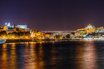 Fototapeta na wymiar Nightscape of Porto and famous bridge over Douro river, Portugal