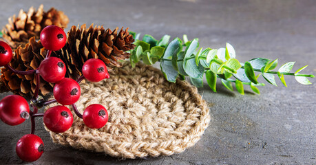 Natural jute napkin for eco, tableware setting on gray background with blank pages with copyspace. Handmade and hobby concept, selective focus