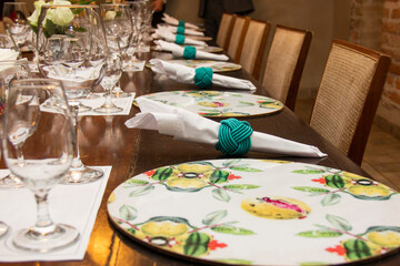 Dining table with bowls and dishes set for dinner and wine tasting.
