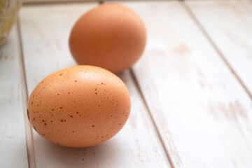 Brown chicken eggs on white background, space for text