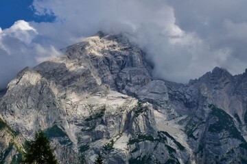 mountains in the clouds, photo as a background , in dolomites mountains, autumn in italy