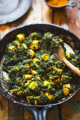 Saag paneer - fried cheese with turmeric and spinach garam masala 