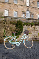 Fototapeta na wymiar Vintage blue city bike in a Glasgow park