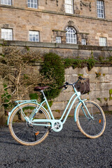 Fototapeta na wymiar Vintage blue city bike in a Glasgow park