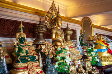 Buddha statues on the altar inside the phu khao thong or golden mountain of wat saket, or the golden mount temple. A landmark of bangkok city, Thailand.