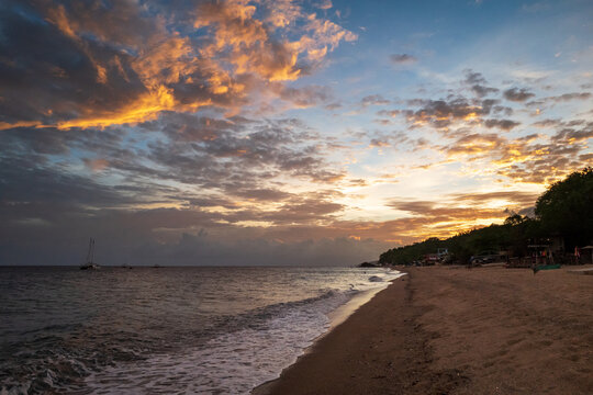 Dramatic sunset on Laiya beach, San Juan, Batangas Province, Luzon island, Philippines.