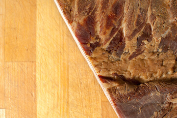 Smoked bacon on wooden background