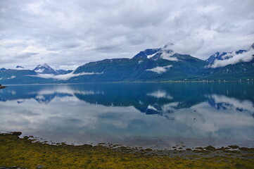 South of Djupvik, looking accros Lyngen Fjord at the Lyngen Alkps, Finnmark County, Norway