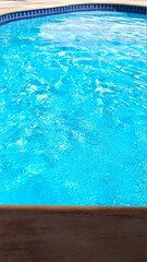 Fototapeta na wymiar blue pool water on Brazilian farm house