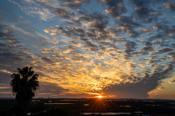 beautiful sunset over the coast of Andalusia and the salines at Isla Cristina