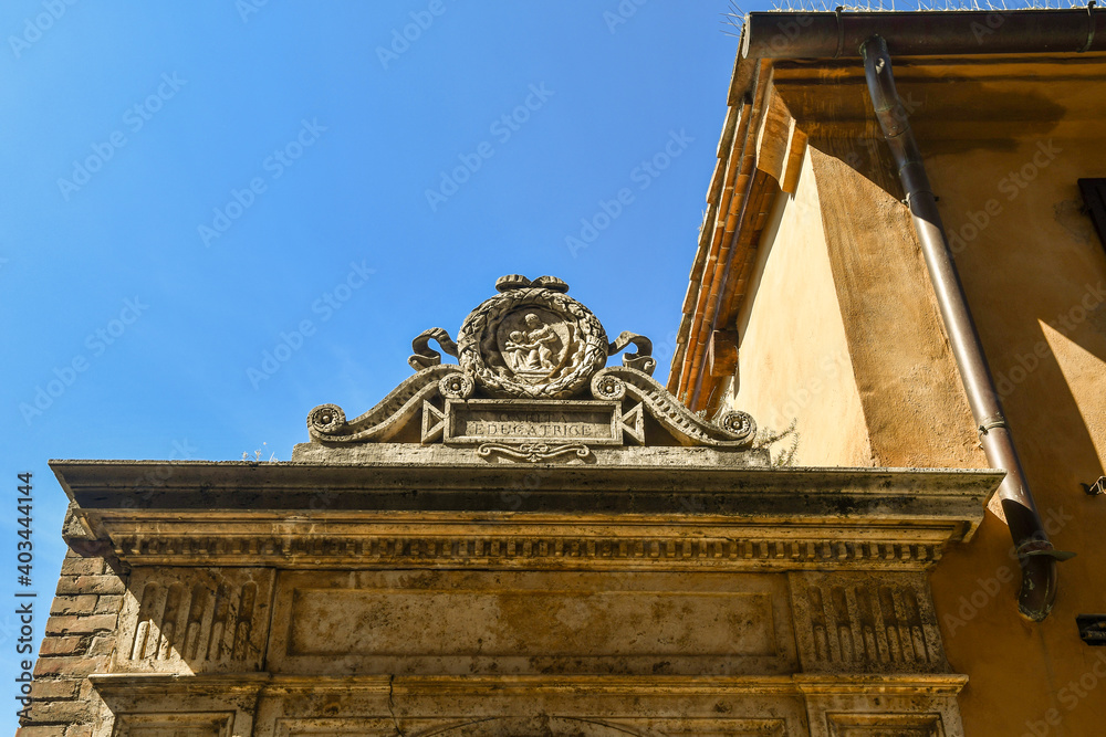 Wall mural exterior of an old building with a stone bas-relief depicts the 