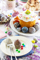 Festive table setting. Easter table with Easter orthodox cakes and Easter eggs.