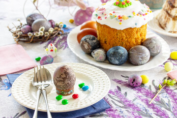 Festive table setting. Easter table with Easter orthodox cakes and Easter eggs.